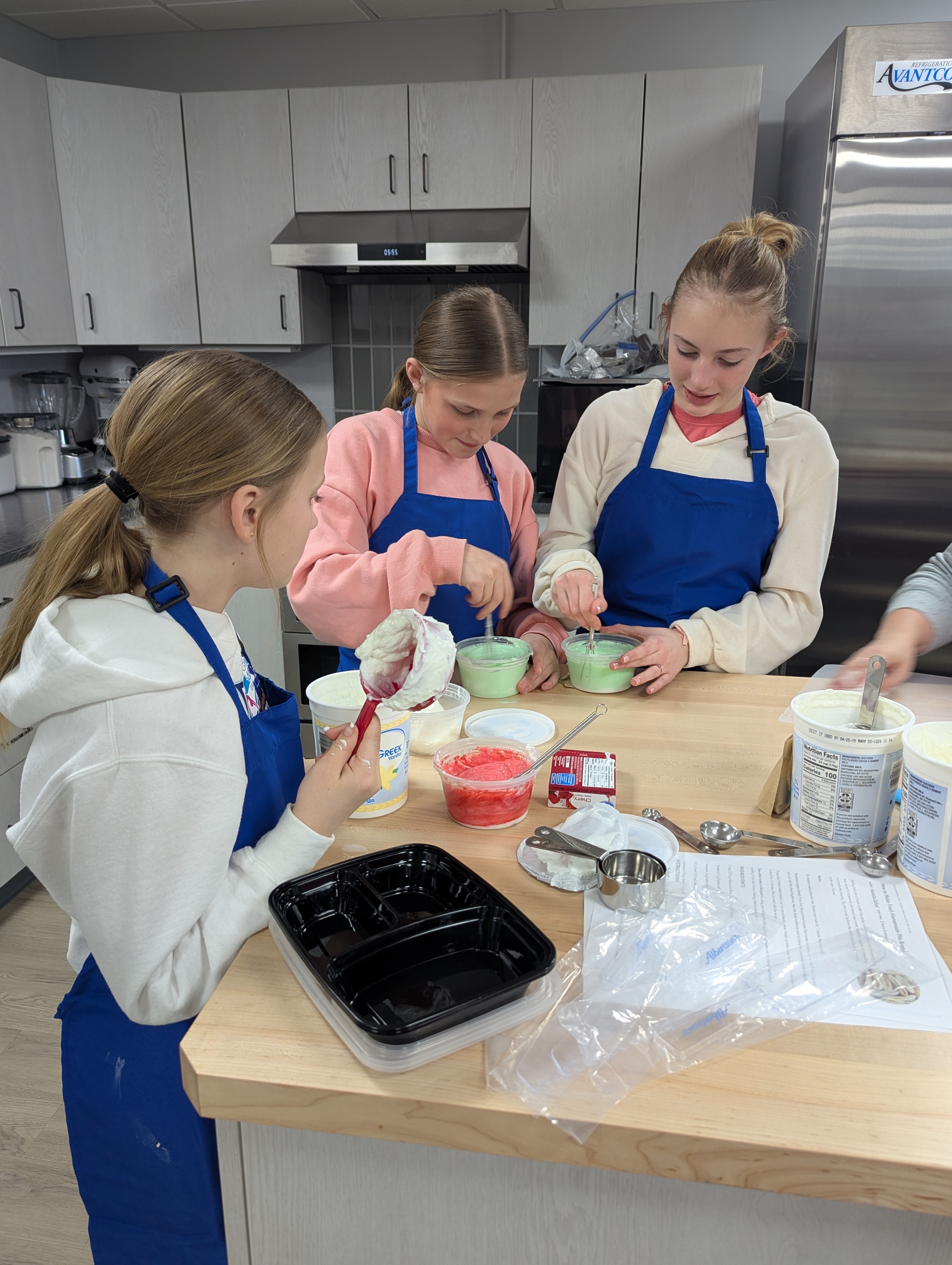 Youth made healthy snack dips using plain yogurt with flavored gelatin, taco seasoning and homemade ranch seasoning.